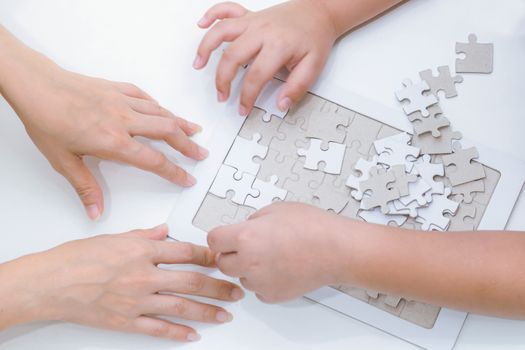 Adults and children development to jigsaw the skills, ideas, abilities