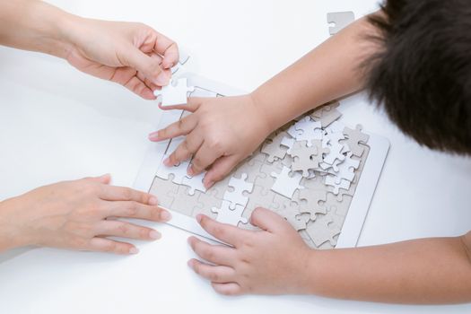 Adults and children development to jigsaw the skills, ideas, abilities