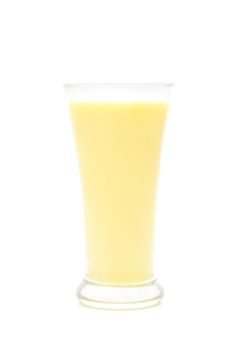 Corn milk in a glass on a white background