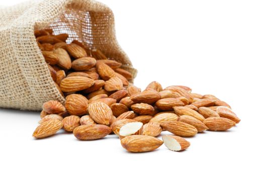 Almonds in a sack of cloth on a white background