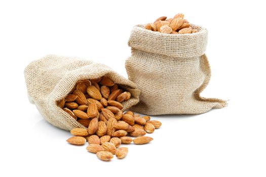 Almonds in a sack of cloth on a white background