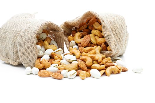 Almonds Pistachio and  Cashews in a sack on a white background