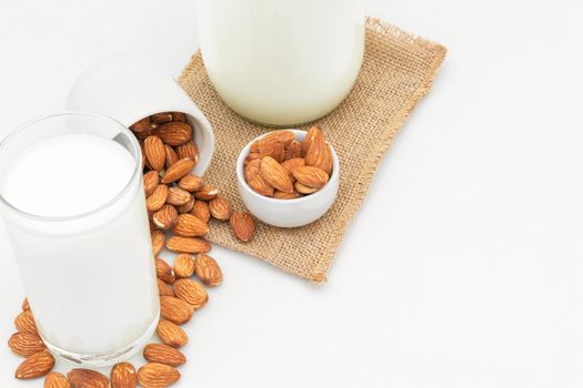 Milk Almonds in a glass on a white background