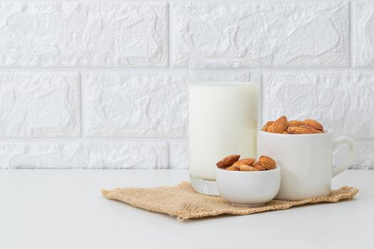 Milk Almonds in a glass on a white background