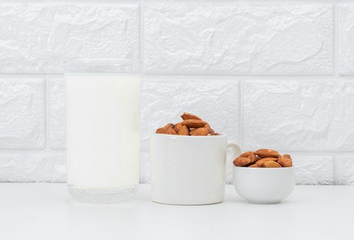 Milk Almonds in a glass on a white background