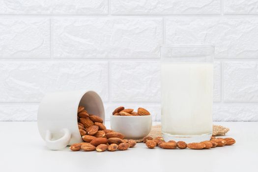 Milk Almonds in a glass on a white background