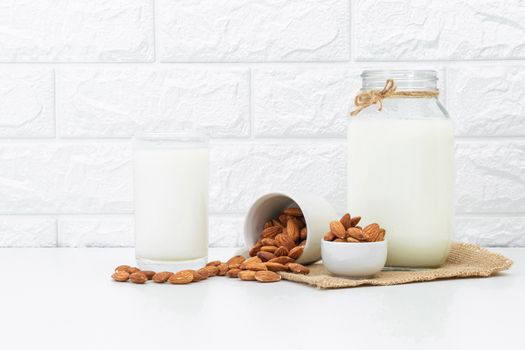 Milk Almonds in a glass on a white background