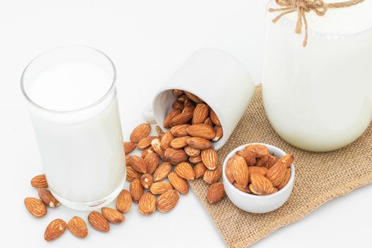 Milk Almonds in a glass on a white background