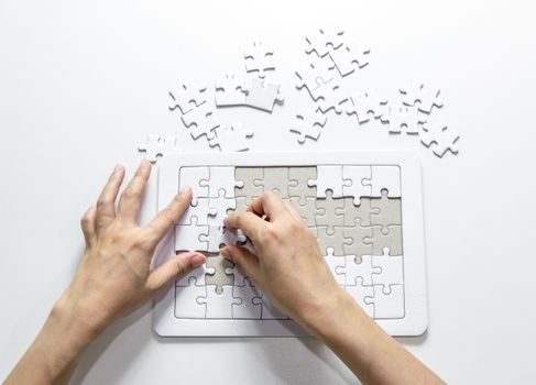 Fill the missing parts fragment of white jigsaw concept puzzle for succeed