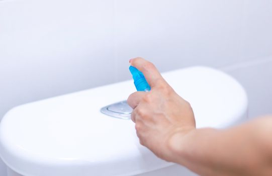 Alcohol spray press flush toilet clean protection against Coronavirus 2019 (Covid-19)