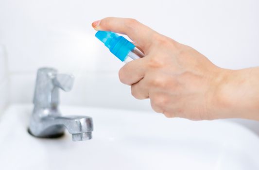 Alcohol spray water tap clean protection against Coronavirus 2019 (Covid-19)