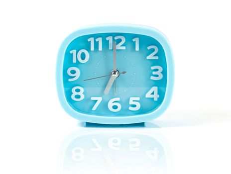 Blue table clock on a white background