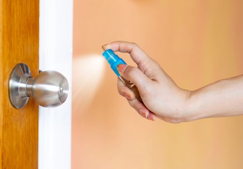 Alcohol spray door clean protection against Coronavirus 2019 (Covid-19)