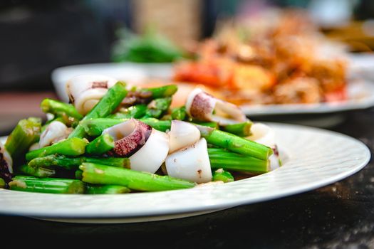 Squid puff with asparagus of restaurant with other dishes