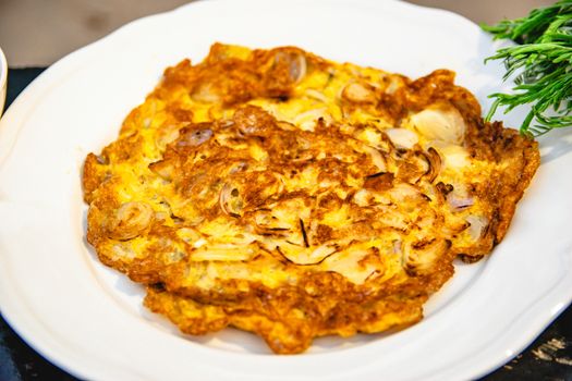 Fried eggs burn in a food dish