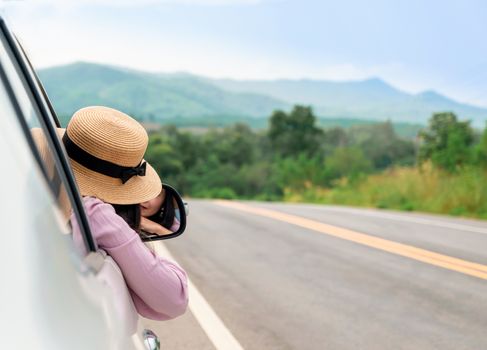 Woman driving on the road Travel by car relax