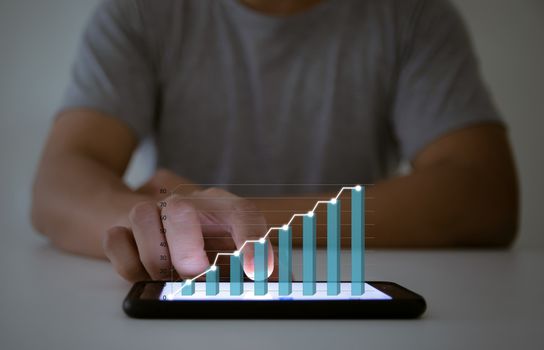 Business analyze graphs with the technology development pointing graph corporate to success and growing plan concept