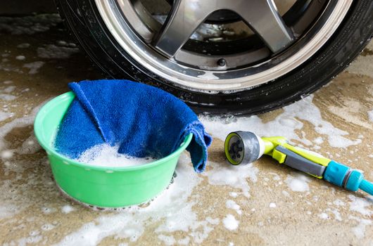 wash a car fabric and bubbles to clean the car