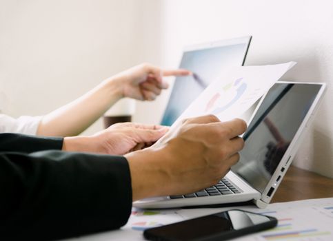 Business hand pointing to computer Human work in the office on the desk