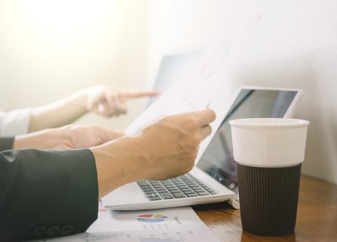 Business hand pointing to computer Human work in the office on the desk