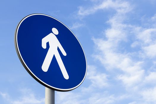 Pedestrian lane road sign on blue sky background