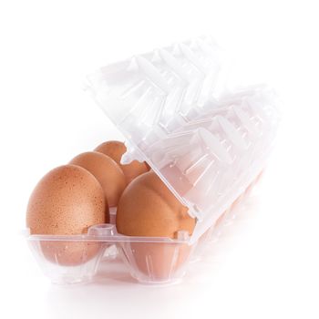 Dozen of the egg at the plastic tray. Shallow depth of field. Defocused blurry background.