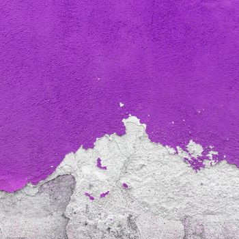 Fragment of wall with broken stucco. Old purple wall with damaged shabby color plaster. Distressed wall background. Concept of renewal, of restore and repair.