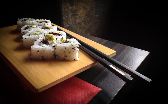 Close up of vegan sushi california roll. Shallow depth of field.