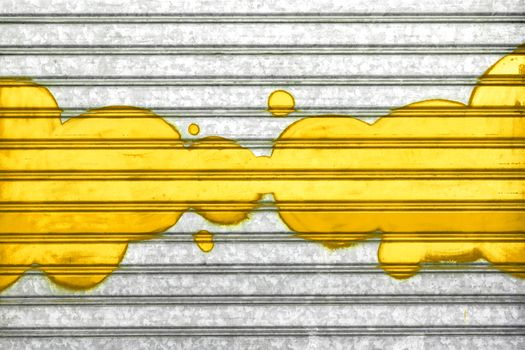 Yellow bubbles painted with spray paint on a roller shutter