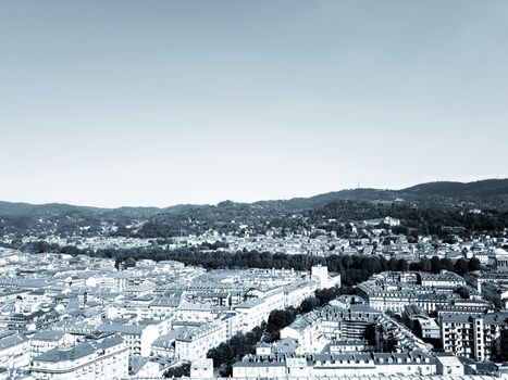 Turin, Italy - 06/06/2020: Beautiful panoramic view from Mole Antoneliana to the city of Turin in summer days with clear blue sky and the alps in the background.