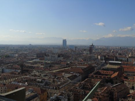 Turin, Italy - 06/06/2020: Beautiful panoramic view from Mole Antoneliana to the city of Turin in summer days with clear blue sky and the alps in the background.