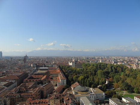 Turin, Italy - 06/06/2020: Beautiful panoramic view from Mole Antoneliana to the city of Turin in summer days with clear blue sky and the alps in the background.