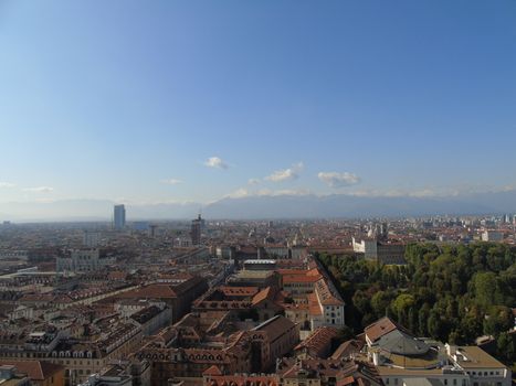 Turin, Italy - 06/06/2020: Beautiful panoramic view from Mole Antoneliana to the city of Turin in summer days with clear blue sky and the alps in the background.