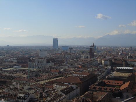 Turin, Italy - 06/06/2020: Beautiful panoramic view from Mole Antoneliana to the city of Turin in summer days with clear blue sky and the alps in the background.