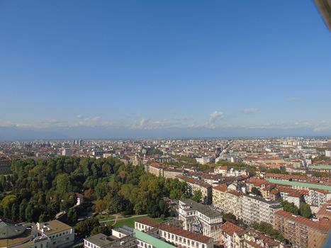 Turin, Italy - 06/06/2020: Beautiful panoramic view from Mole Antoneliana to the city of Turin in summer days with clear blue sky and the alps in the background.