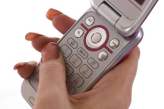 A female hand texting on a mobile phone