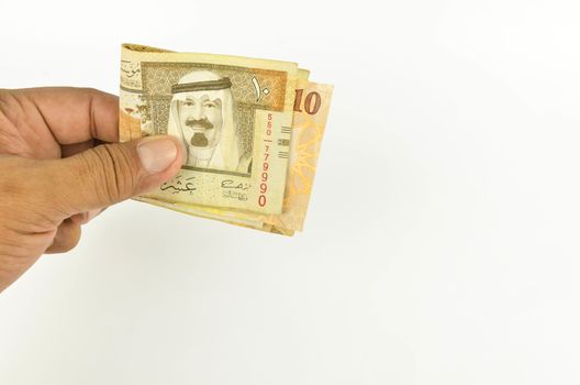 Saudi Arabia money on white background.