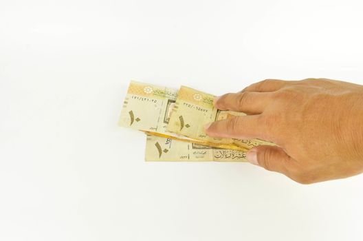 Saudi Arabia money on white background.