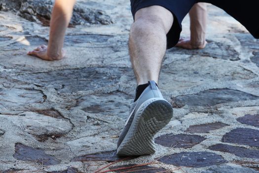 A shot of a sport man doing a push-up outdoors