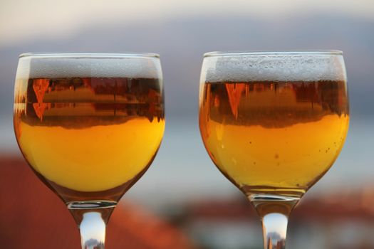 Two glasses of beer summer evening vacation relax concept