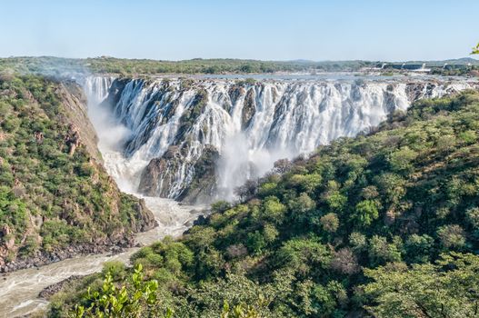 The Ruacana waterfall in the Kunene River. Angola is visible behind the falls
