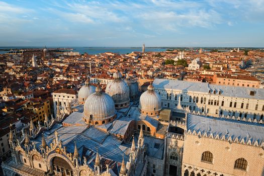 View of Venice with famous St Mark's Basilica and Doge's Palace on sunset from St Mark's Campanile bell tower, Venice, Italy