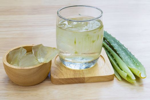 Aloe Vera for drinking on wood table 
