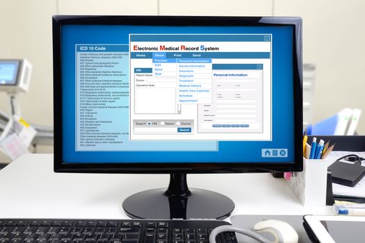 Medical information and electronic medical record system show on computer display.