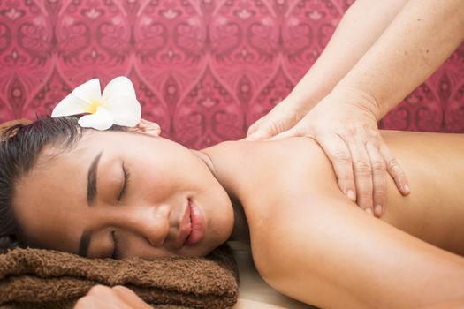 Close-up of a Beautiful Asian Woman Getting Spa Treatment. Massage