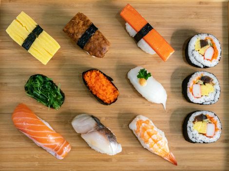 Japanese food and top view concept.  Different kinds of sushi on plate