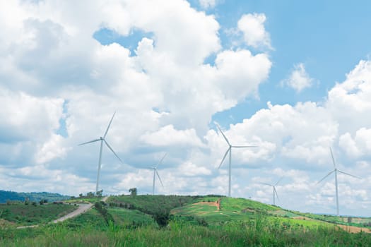 Wind turbine with blue sky and cloudy background