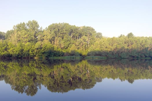 Beautiful summer landscape with river and forest