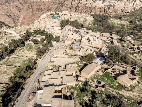 Aerial view of the village Dana and its surroundings at the edge of the Biosphere Reserve of Dana in Jordan, made with drone