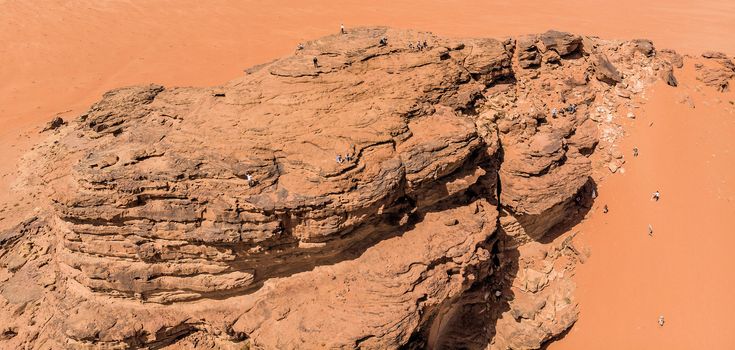 Aerial view, taken with the drone, of rock formations and monolithic mountains in the desert of Wadi Rum, Jordan, middle east